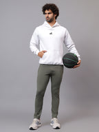 Model wearing Athfuel Vulcan Trackpants for training and everyday wear – Soft Green