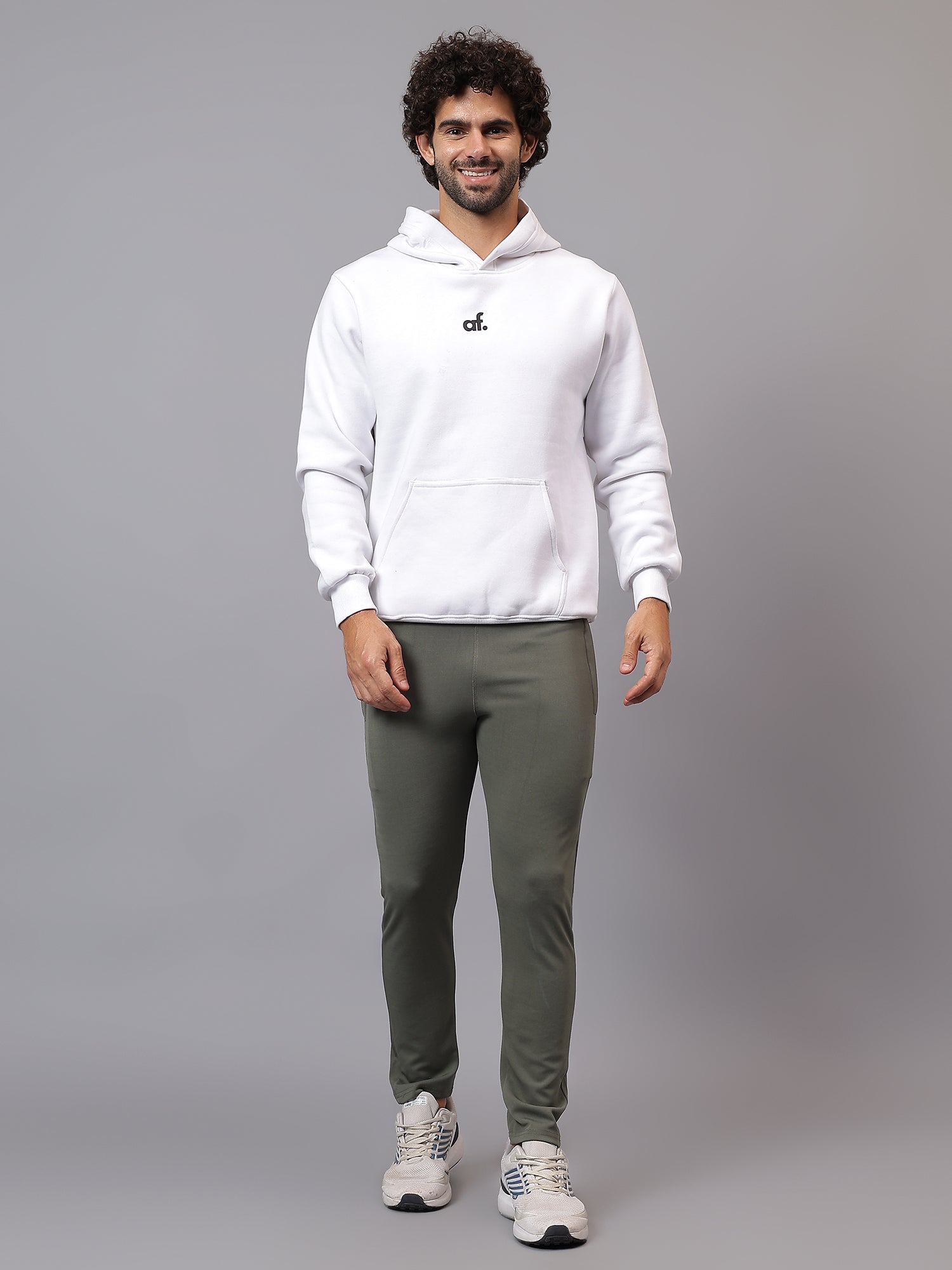 Model wearing Athfuel Vulcan Trackpants for training and everyday wear – Soft Green