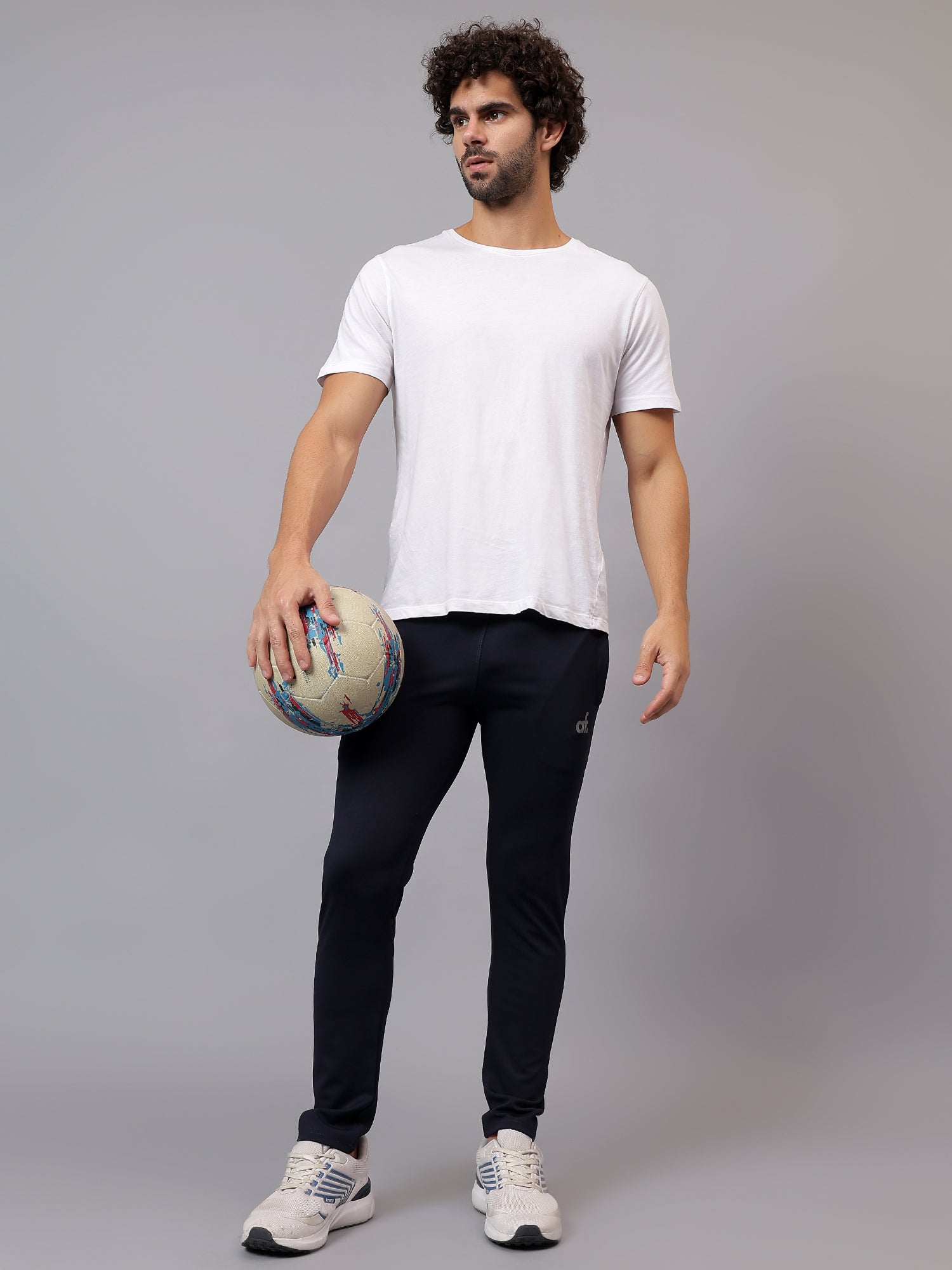 Model wearing Athfuel Vulcan Trackpants during workout – Blue