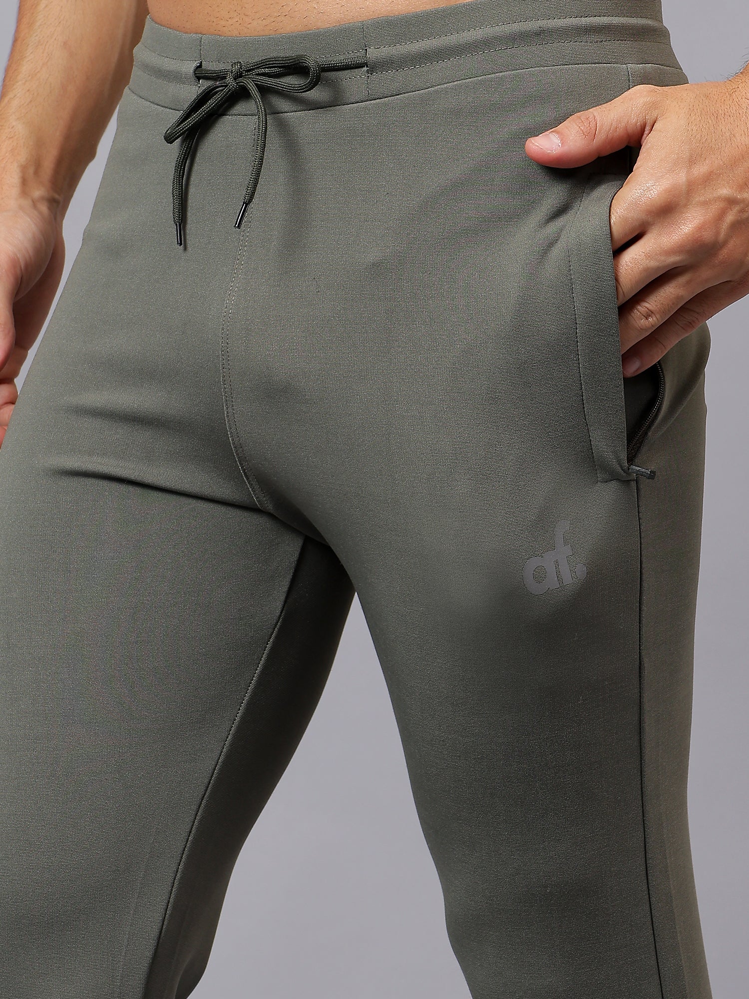 Side view of Athfuel Vulcan Trackpants made for movement and comfort – Soft Green