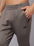 Close-up of Athfuel Drift Joggers showing smooth butter lycra texture – Dust Brown