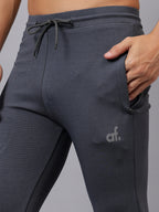 Close-up of Athfuel Vulcan Trackpants showing smooth performance fabric – Dark Grey
