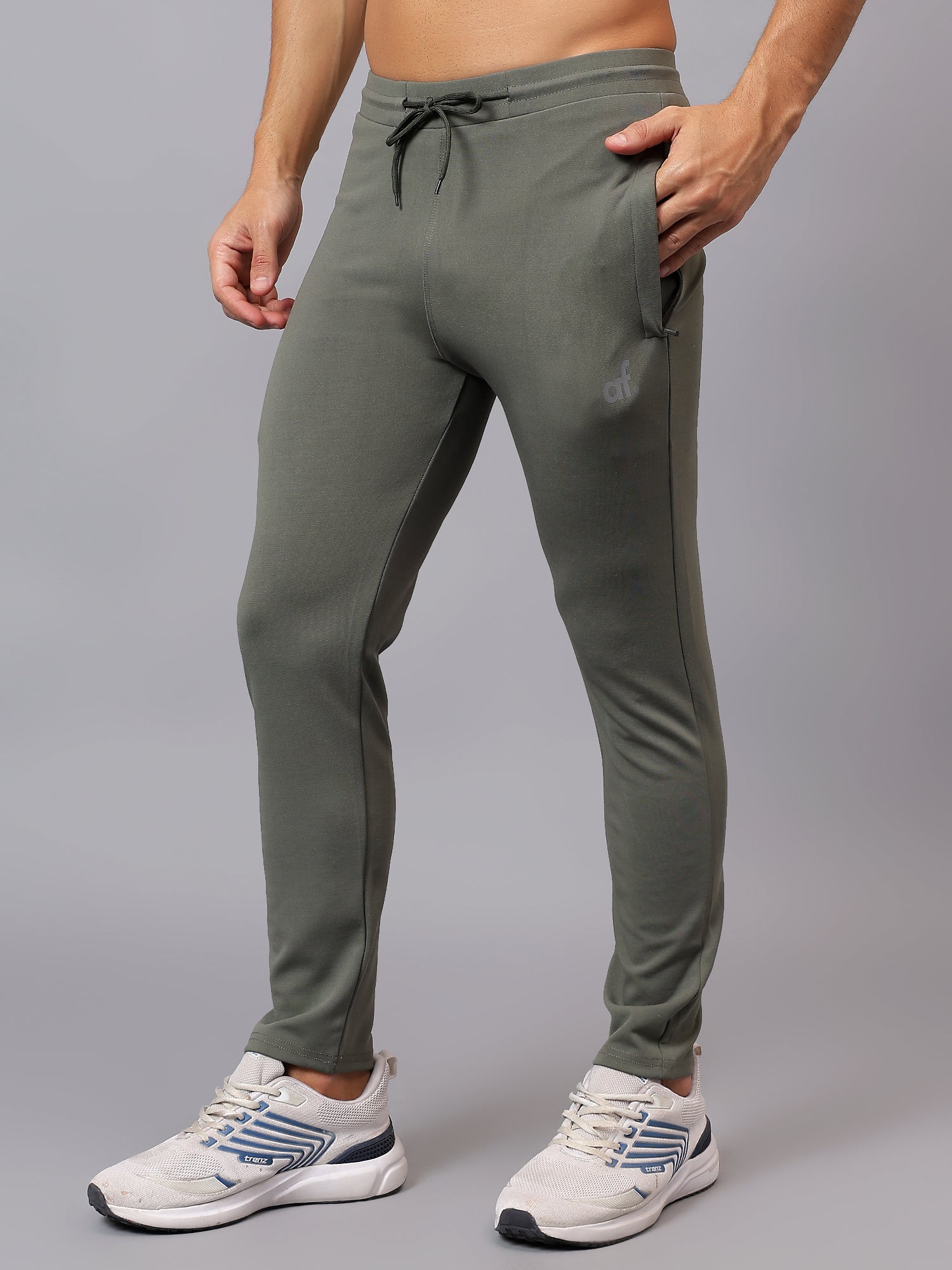 Side view of Athfuel Vulcan Trackpants made for movement and comfort – Soft Green