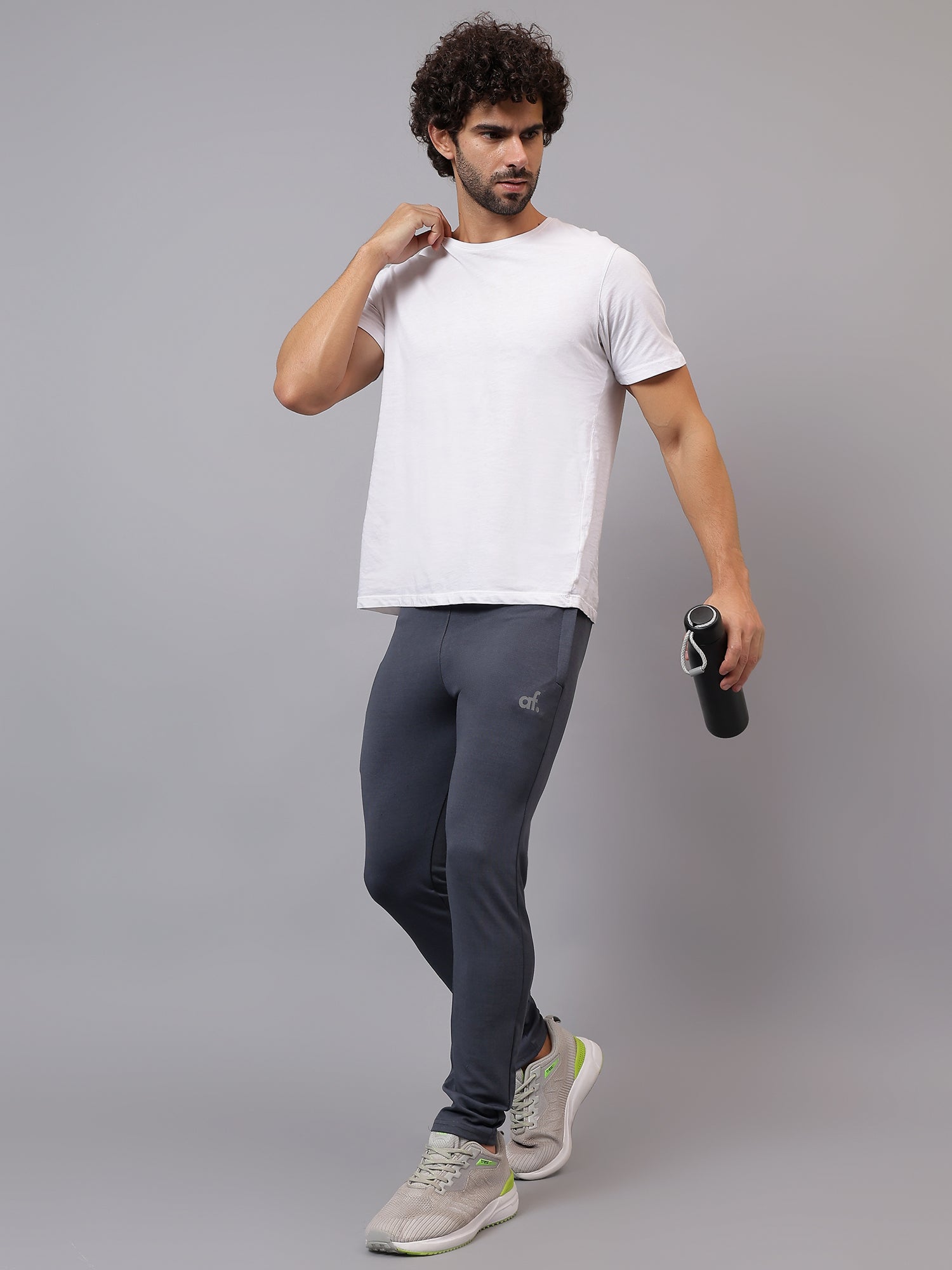 Model wearing Athfuel Vulcan Trackpants for gym and active movement – Dark Grey