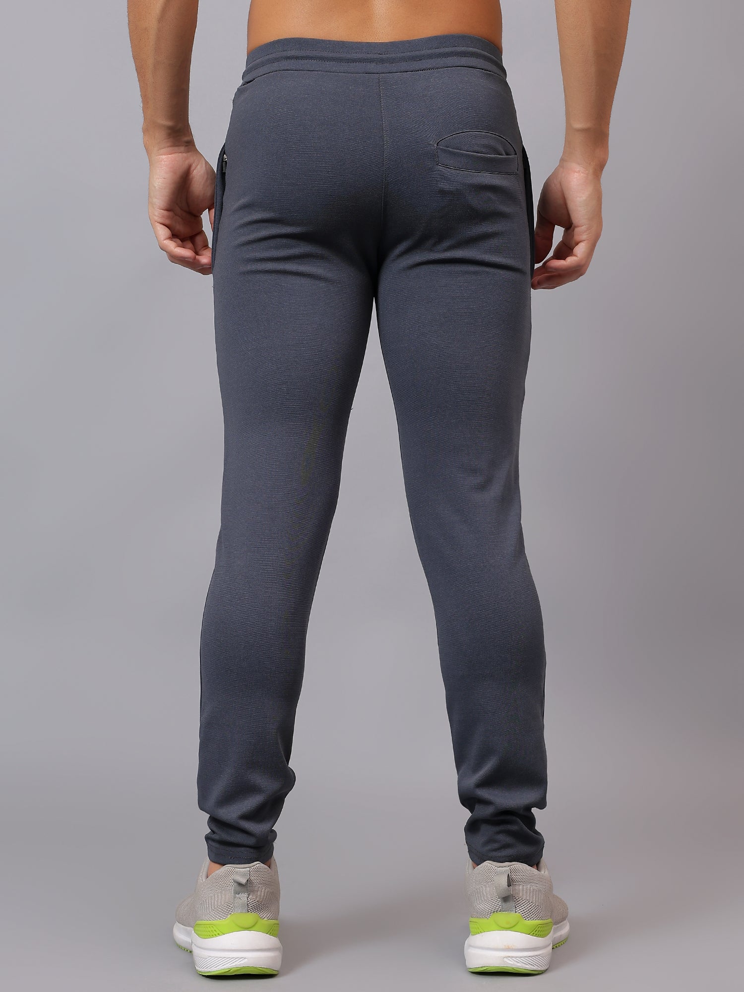 Back profile of Athfuel Vulcan Trackpants designed for workouts and training – Dark Grey