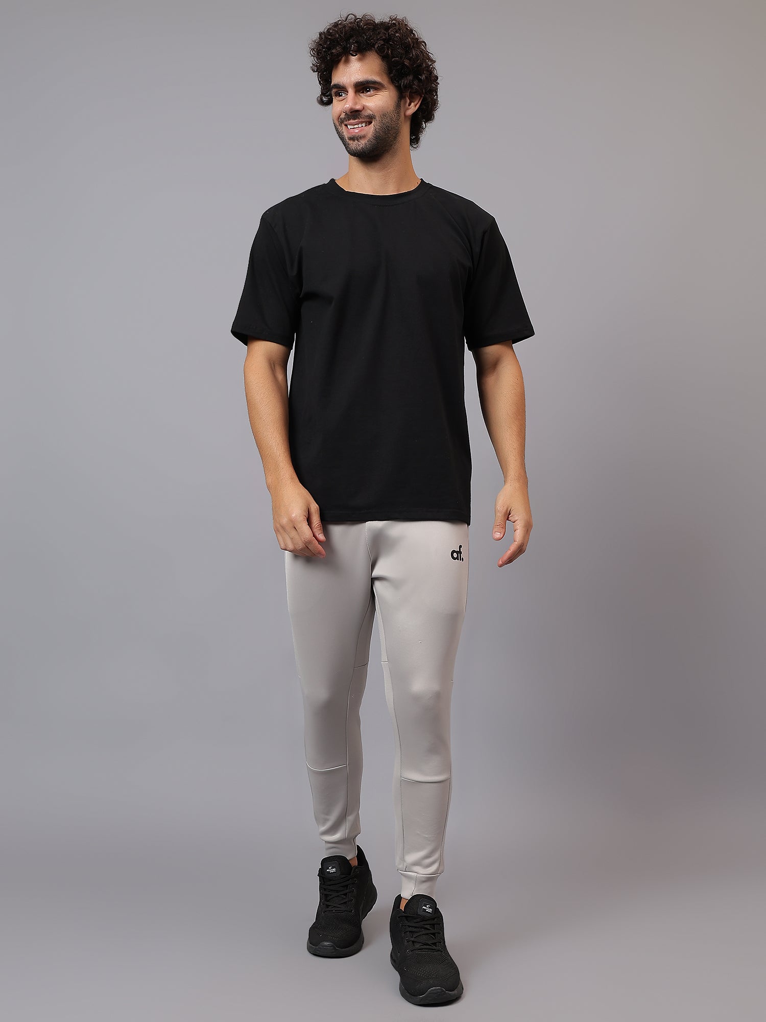 Model wearing Athfuel Drift Joggers for gym and casual wear – Soft Grey