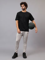 Model wearing Athfuel Drift Joggers for gym and casual wear –Soft Grey