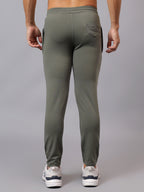 Back view of Athfuel Vulcan Trackpants showing modern activewear design – Soft Green