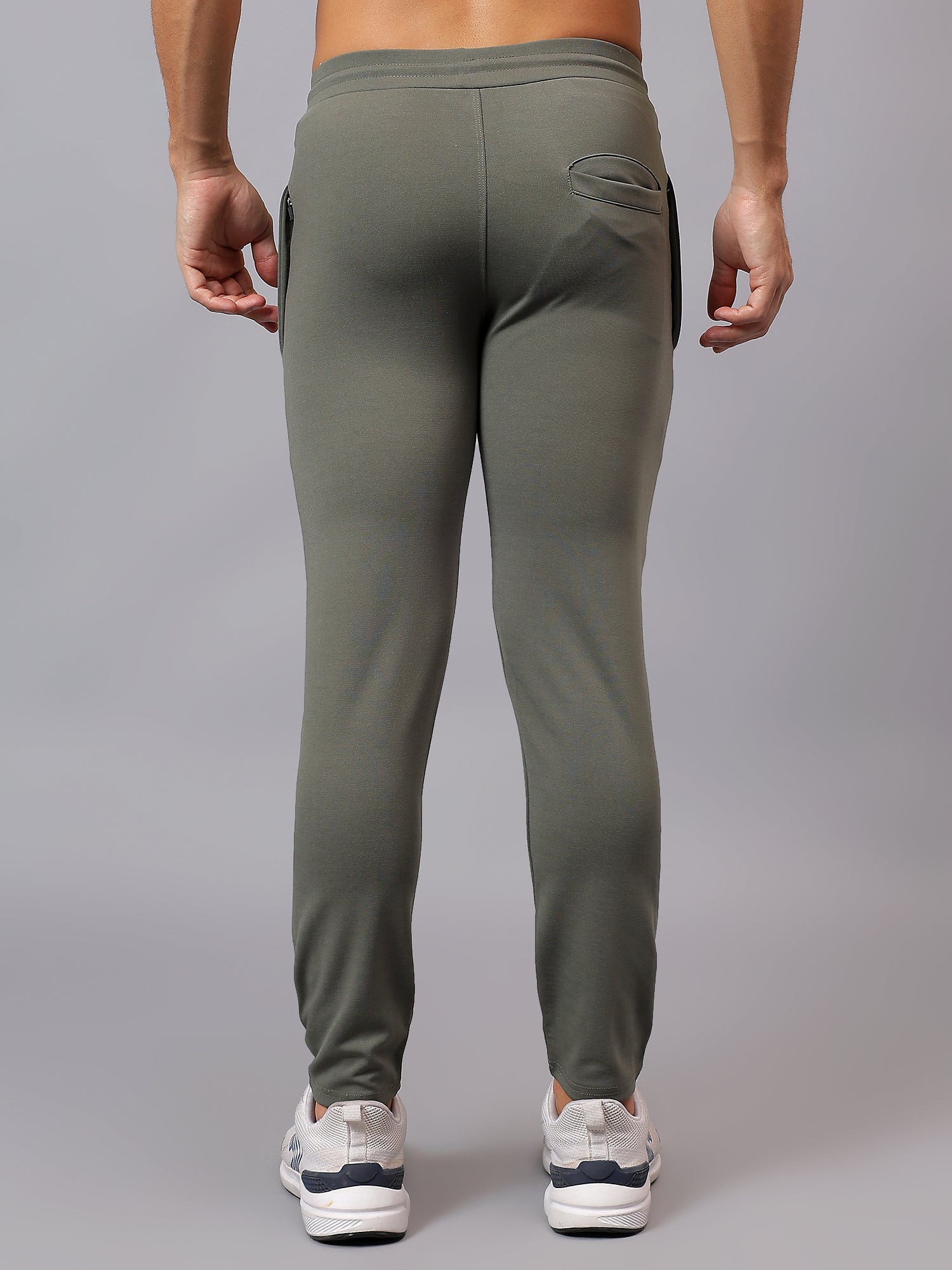 Back view of Athfuel Vulcan Trackpants showing modern activewear design – Soft Green