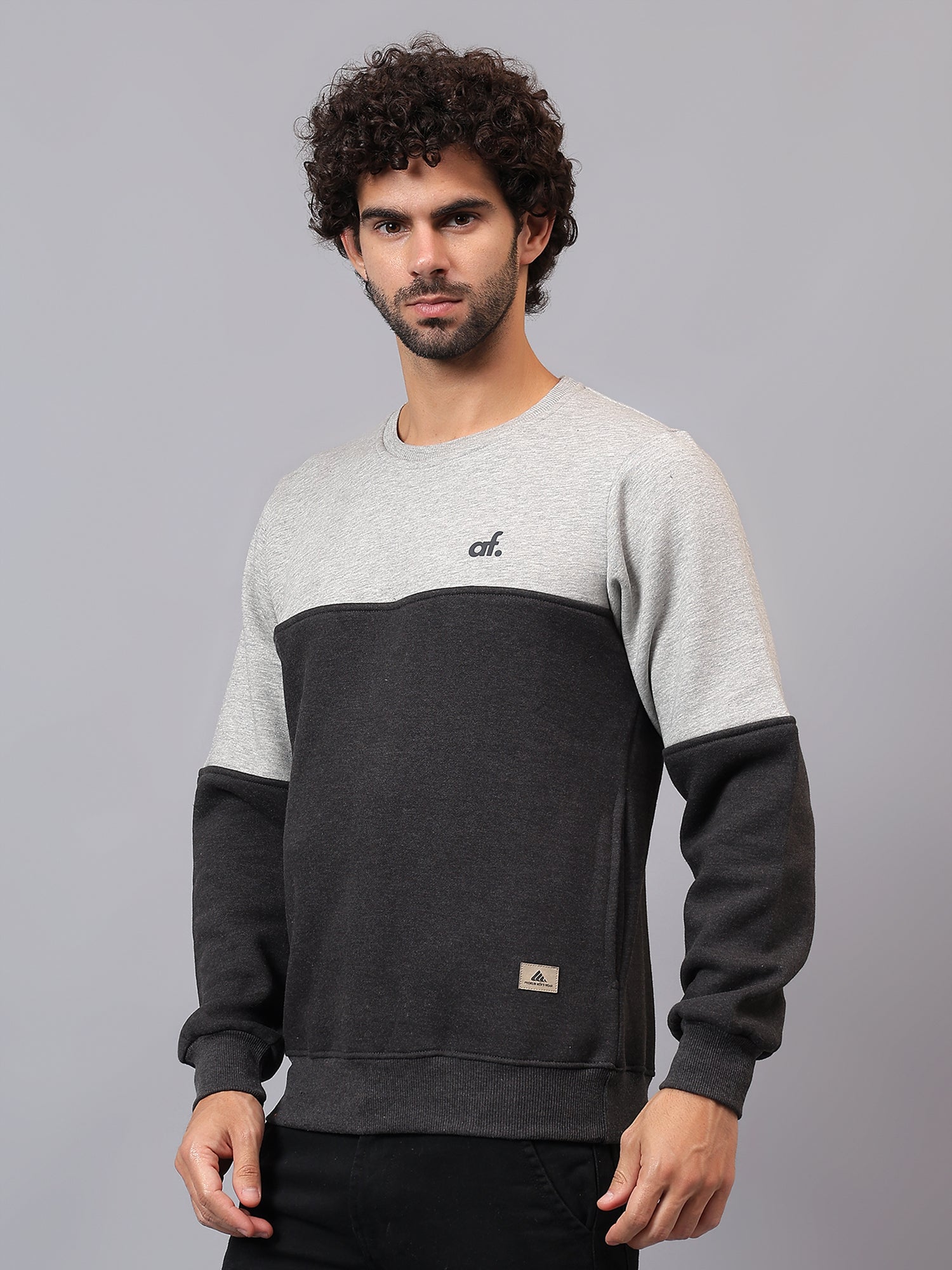 Model wearing Athfuel Merge two-tone sweatshirt styled casually in Grey-DarkGrey