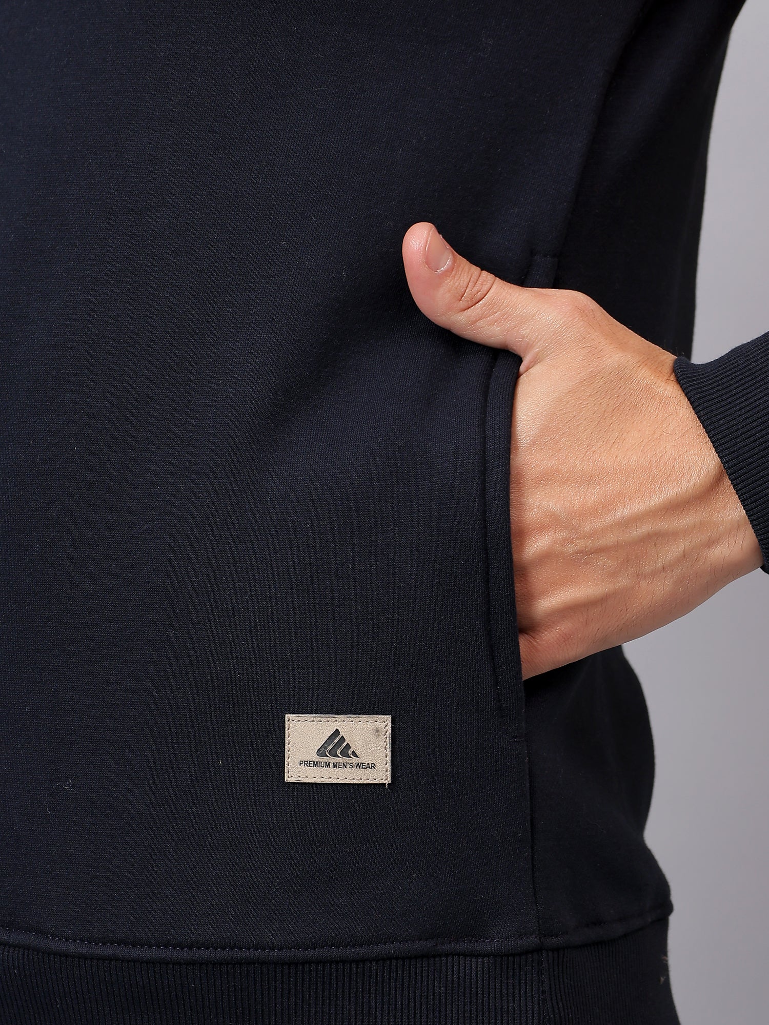 Close-up of soft cotton fabric and dual-tone construction on Athfuel Merge sweatshirt in Orange-NavyBlue